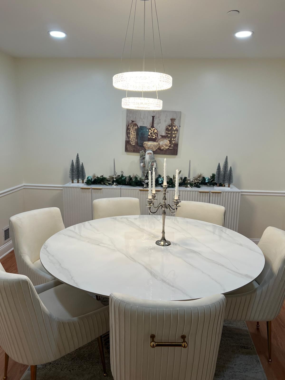 Elegant modern dining room with marble table and chandelier